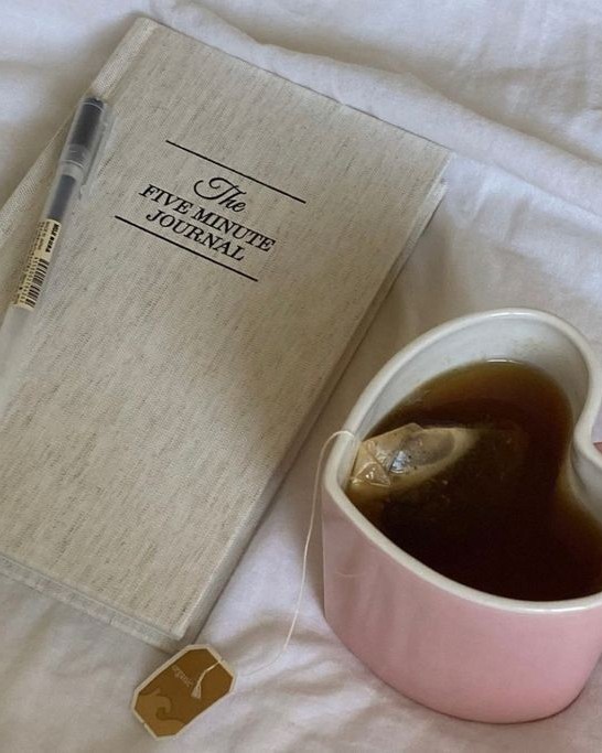 A journal and a cup of tea.